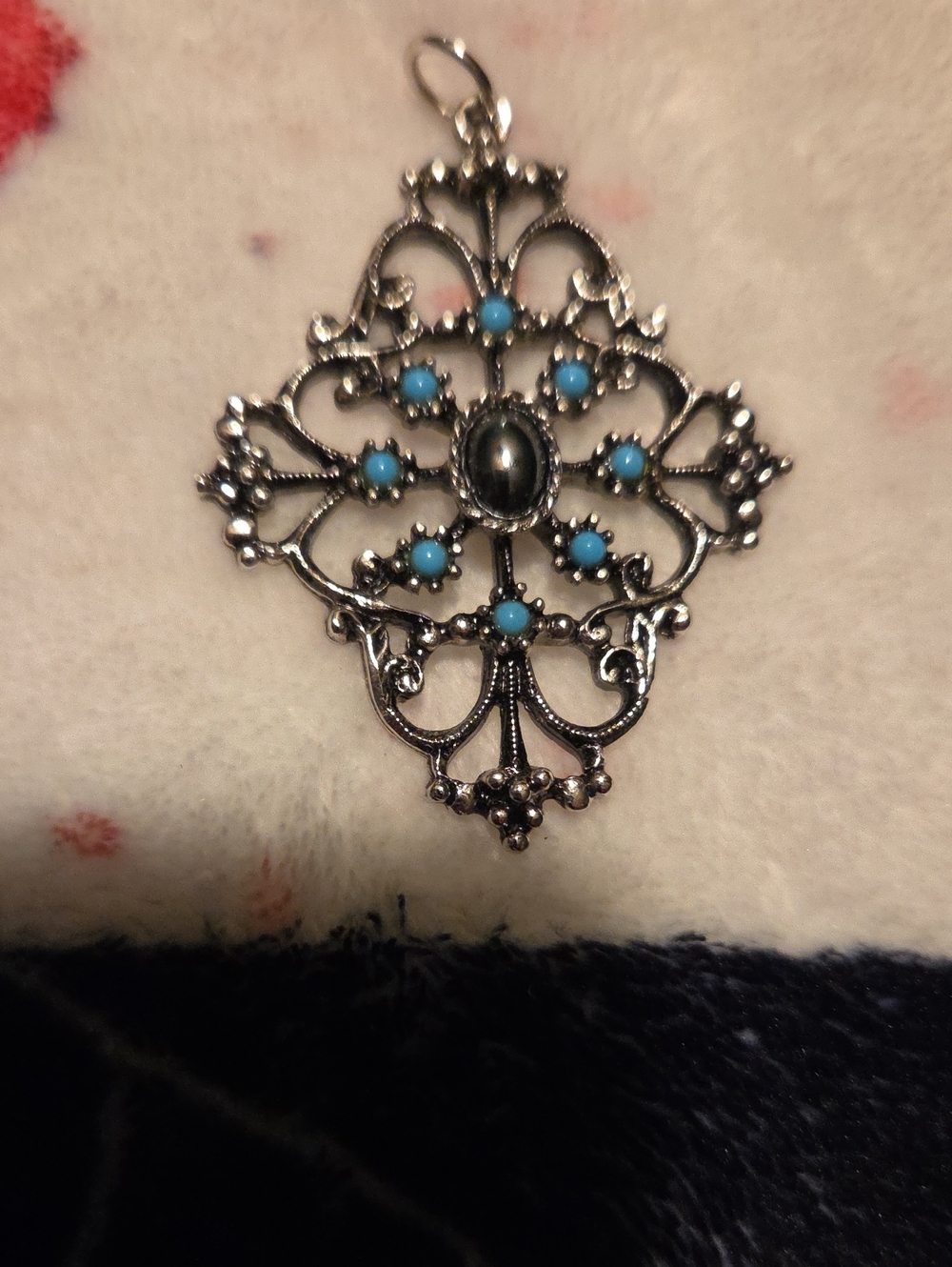 Delicate Silver-Tone Filigree Pendant with Turquoise Accents